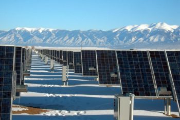 ESG investing from Bionic Capital - Solar power array and snowy mountain range